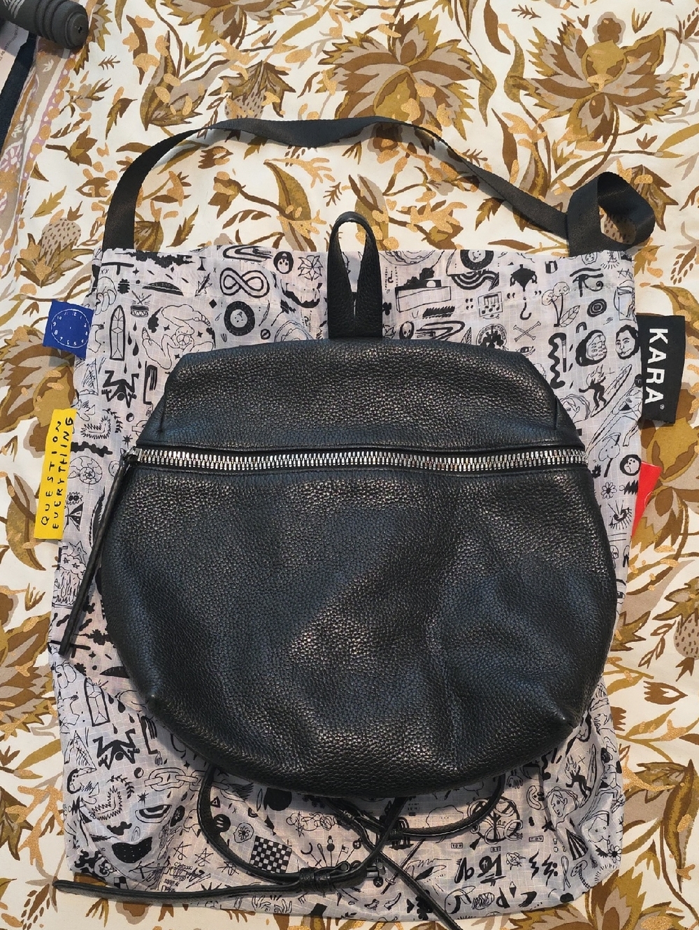 KARA Black Pebbled Round Leather Backpack